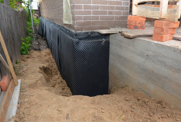 Happy homeowners after waterproofing job in Luttrell